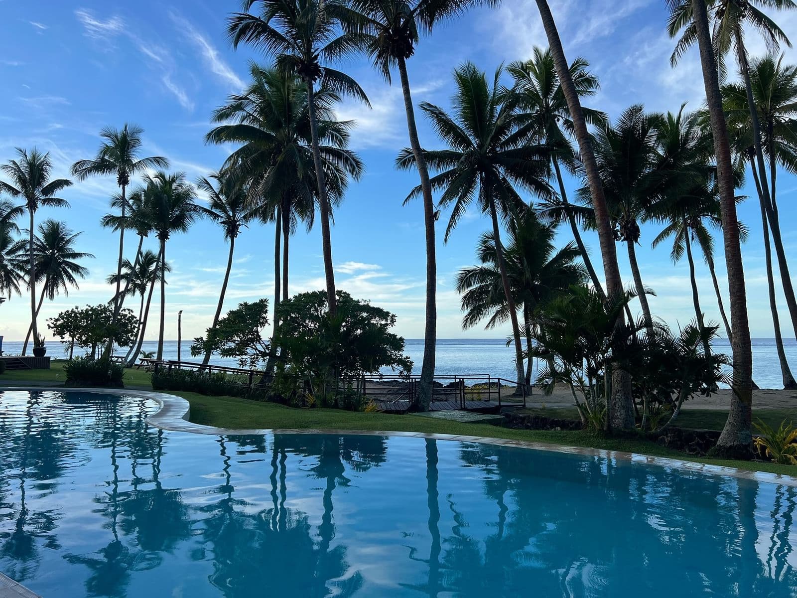 Palm-fringed beachfront pool at Tambua Sands Beach Resort