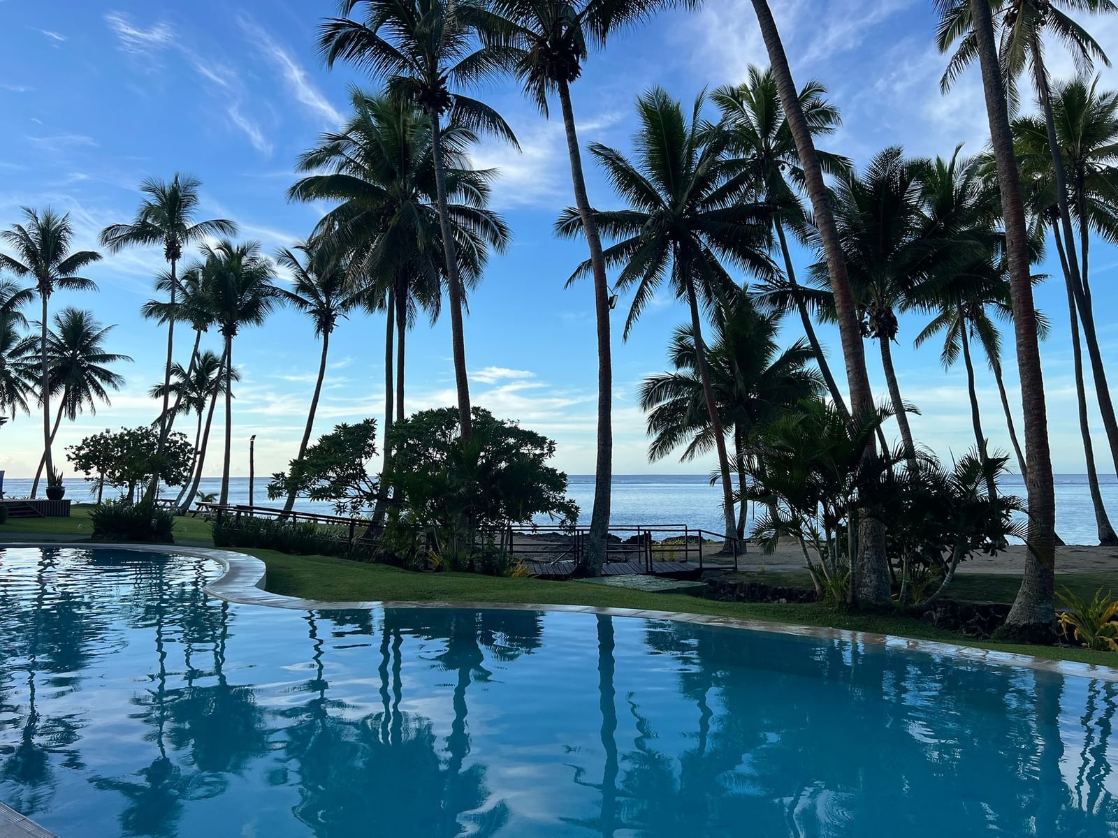 Palm-fringed beachfront pool at Tambua Sands Beach Resort